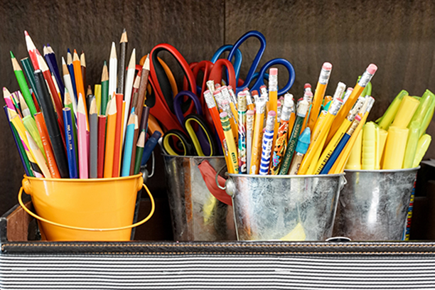 Various School Supplies such as pens and pencils